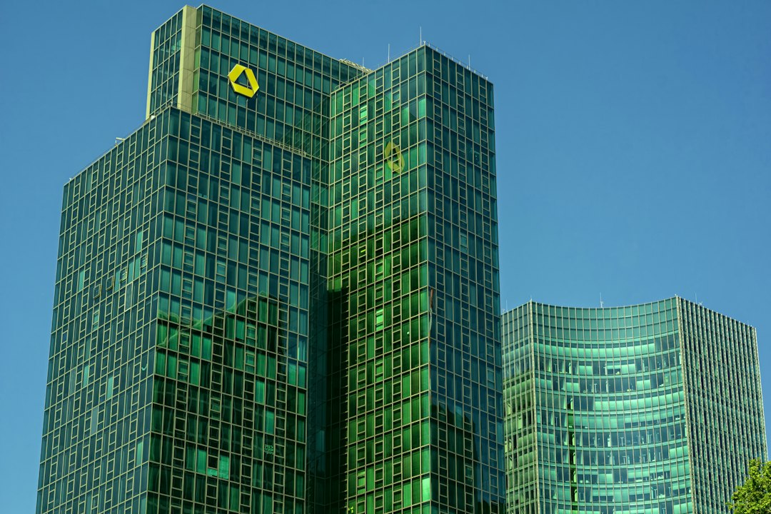 Modern skyscrapers rise against a blue sky